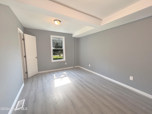 spare room featuring hardwood / wood-style flooring