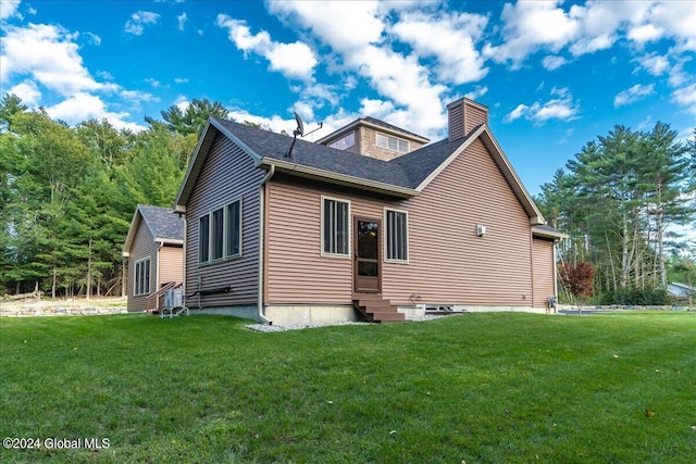 view of home's exterior with a yard