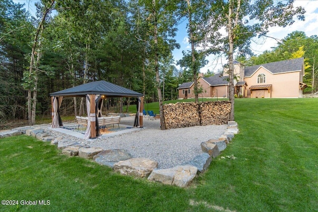 view of yard with a gazebo, a patio area, and an outdoor living space