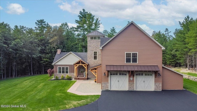 view of front of property with a front lawn and a garage