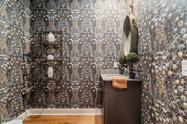 bathroom with vanity and hardwood / wood-style flooring