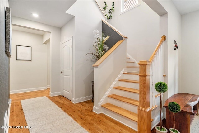 stairway featuring hardwood / wood-style floors