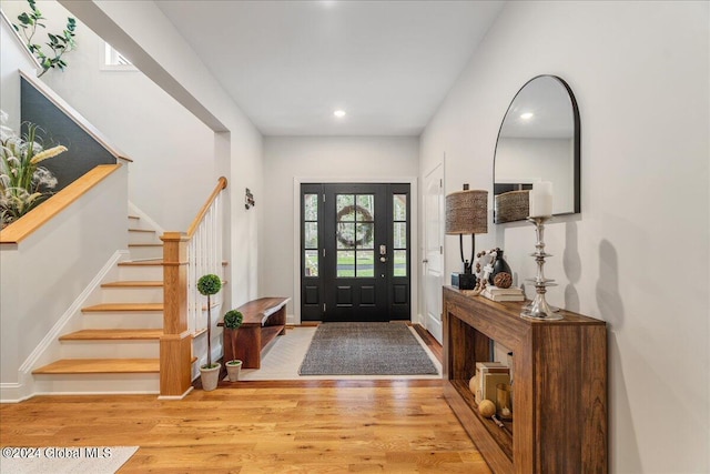 foyer entrance with light hardwood / wood-style flooring