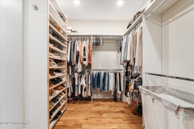 spacious closet featuring hardwood / wood-style floors