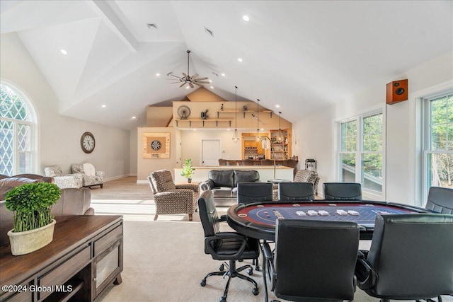 carpeted dining space featuring vaulted ceiling and ceiling fan