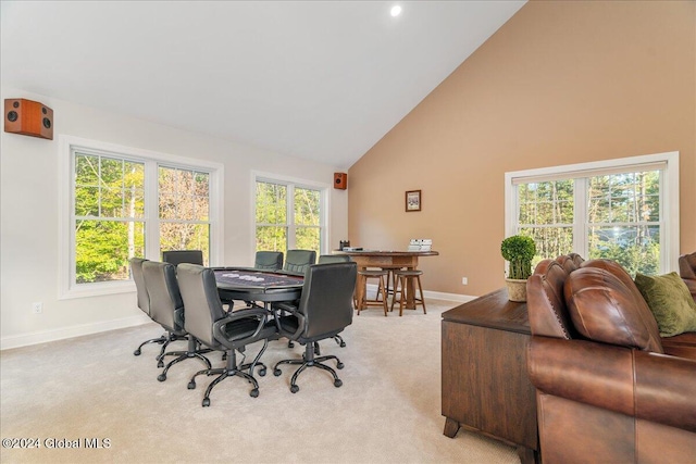 office space featuring light carpet and high vaulted ceiling