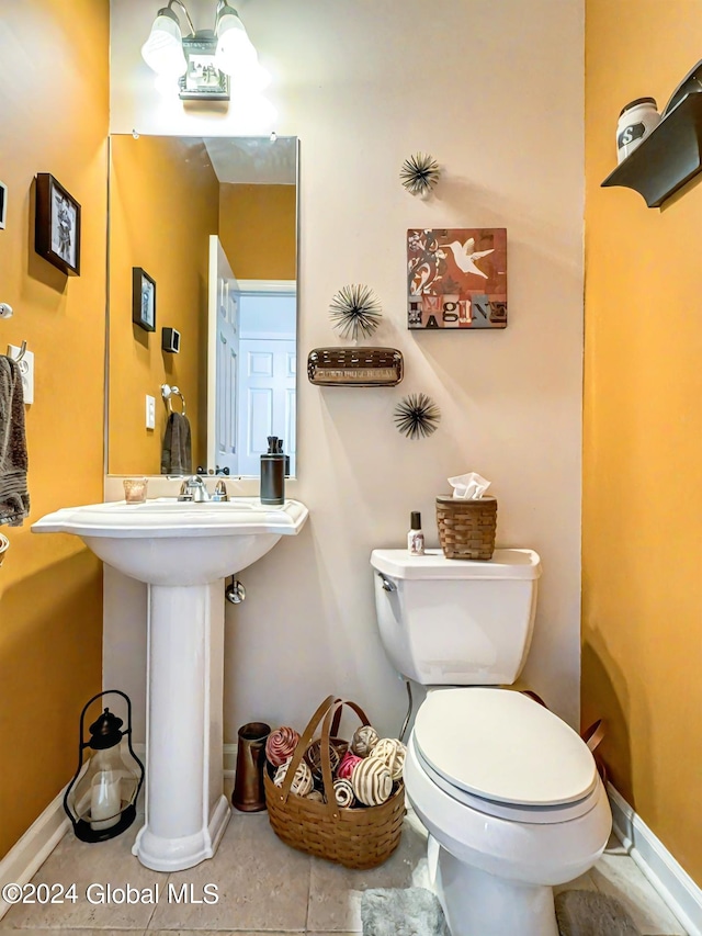 bathroom featuring toilet and tile patterned floors