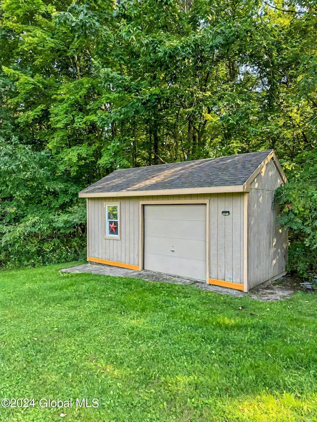 garage with a yard