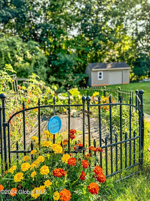 view of gate featuring a storage unit