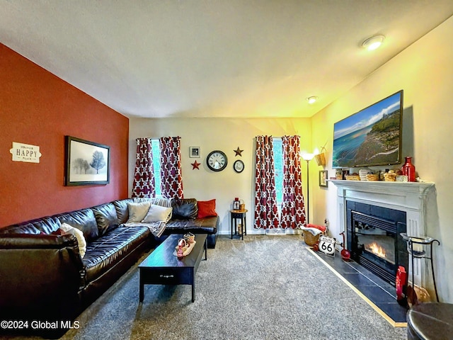 carpeted living room featuring a tile fireplace