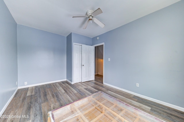 empty room featuring hardwood / wood-style floors and ceiling fan