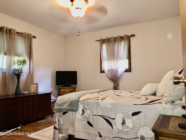 bedroom featuring ceiling fan and wood-type flooring