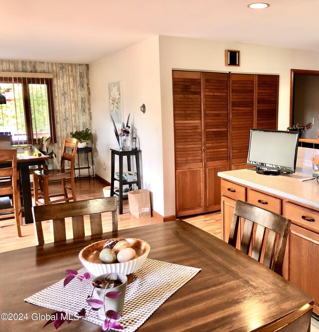 dining area with light hardwood / wood-style floors