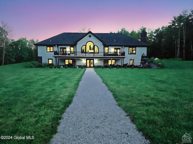 view of front of property with a lawn