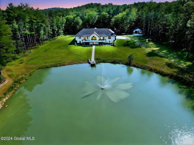 aerial view at dusk with a water view