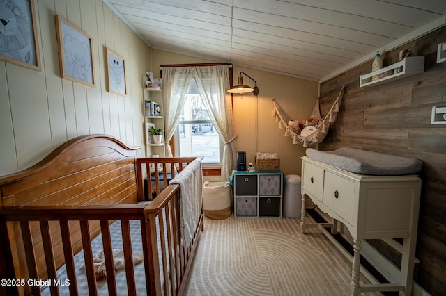 carpeted bedroom featuring vaulted ceiling