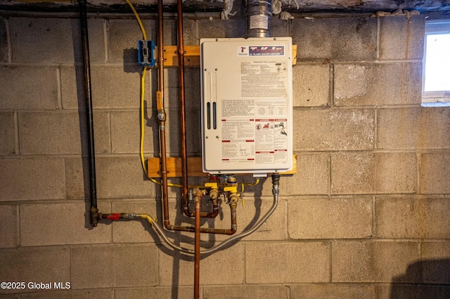 utility room featuring water heater