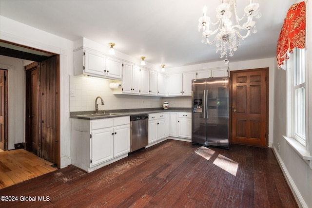 kitchen featuring white cabinetry, a chandelier, stainless steel appliances, dark hardwood / wood-style flooring, and sink