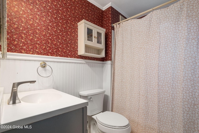 bathroom with walk in shower, toilet, ornamental molding, and vanity