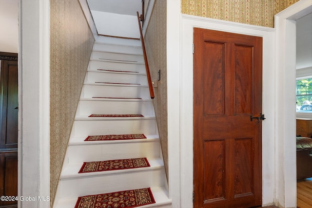 staircase featuring hardwood / wood-style flooring