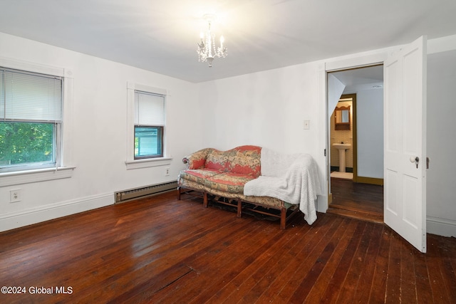 sitting room featuring baseboard heating, an inviting chandelier, sink, and dark hardwood / wood-style floors