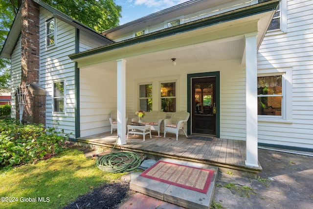 rear view of house with a wooden deck