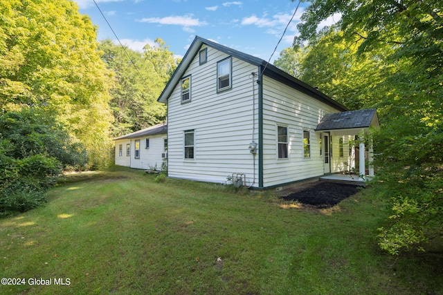 view of property exterior featuring a lawn