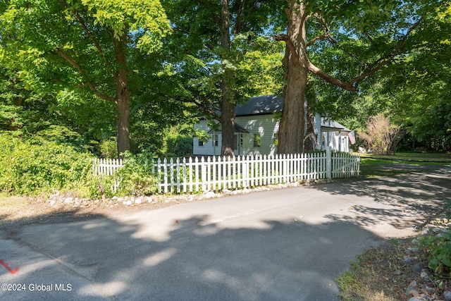 view of property hidden behind natural elements