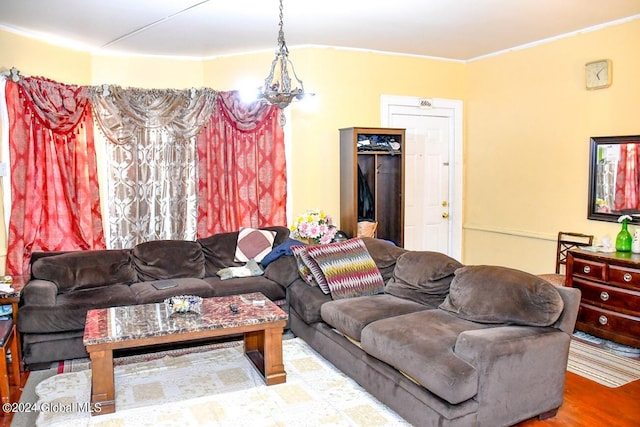 living room with crown molding and hardwood / wood-style flooring