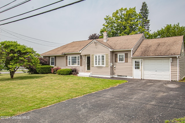 single story home with a garage and a front lawn