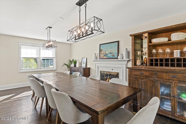 dining space with dark hardwood / wood-style floors