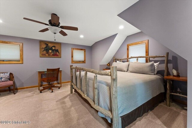 carpeted bedroom featuring ceiling fan and lofted ceiling