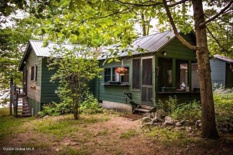 back of property featuring a sunroom