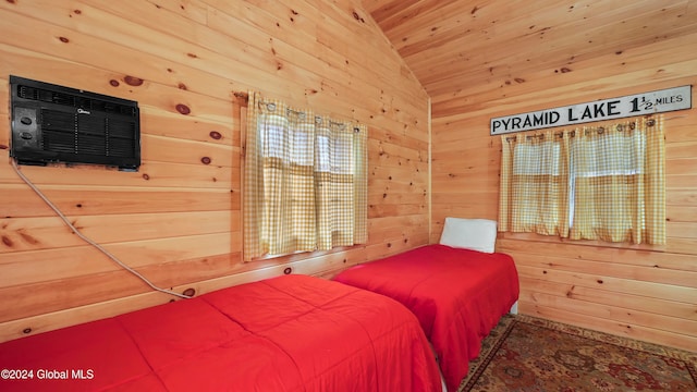 bedroom with wood walls, a wall unit AC, and vaulted ceiling