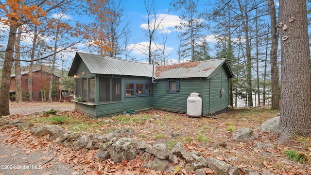 exterior space featuring a sunroom