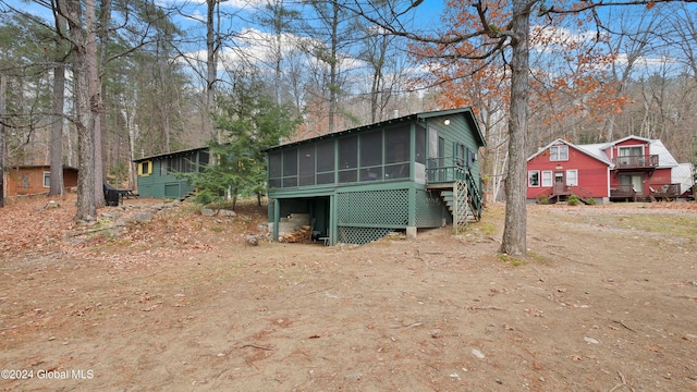 exterior space featuring a sunroom