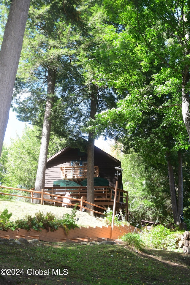 back of house with a wooden deck