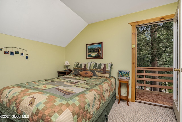 bedroom featuring lofted ceiling and carpet flooring