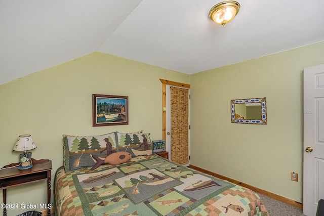 bedroom featuring carpet floors and lofted ceiling