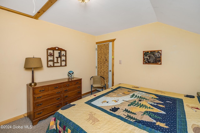 bedroom with lofted ceiling and carpet floors