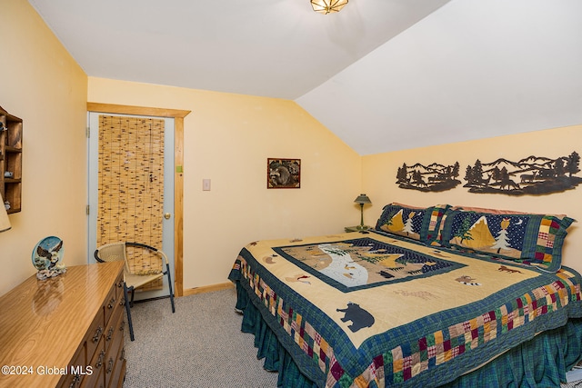 bedroom with lofted ceiling and carpet flooring