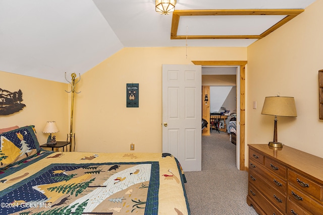 carpeted bedroom featuring vaulted ceiling