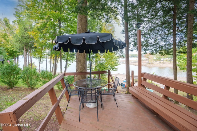 wooden deck with a water view