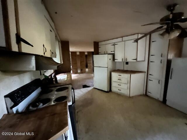 kitchen featuring white cabinets, white appliances, and ceiling fan