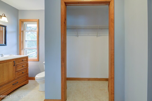 bathroom featuring vanity and toilet