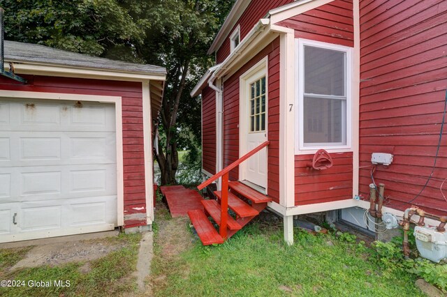 view of side of home with a garage