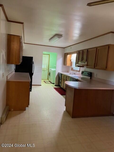 kitchen with exhaust hood, a baseboard radiator, range with electric stovetop, washing machine and clothes dryer, and kitchen peninsula