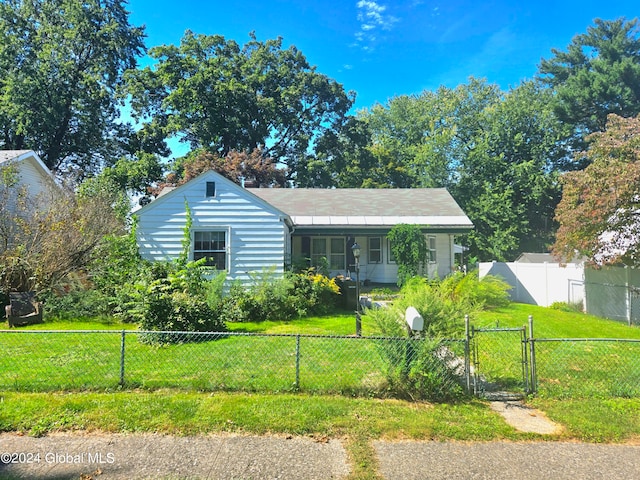 bungalow-style house with a front lawn and a porch