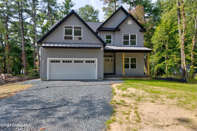 view of front of house with a front lawn and a garage