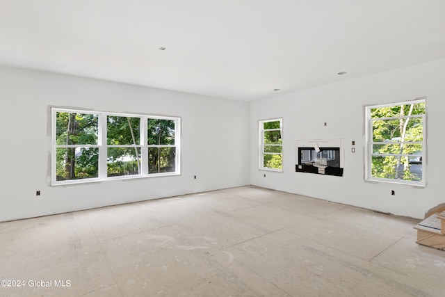 unfurnished living room with plenty of natural light